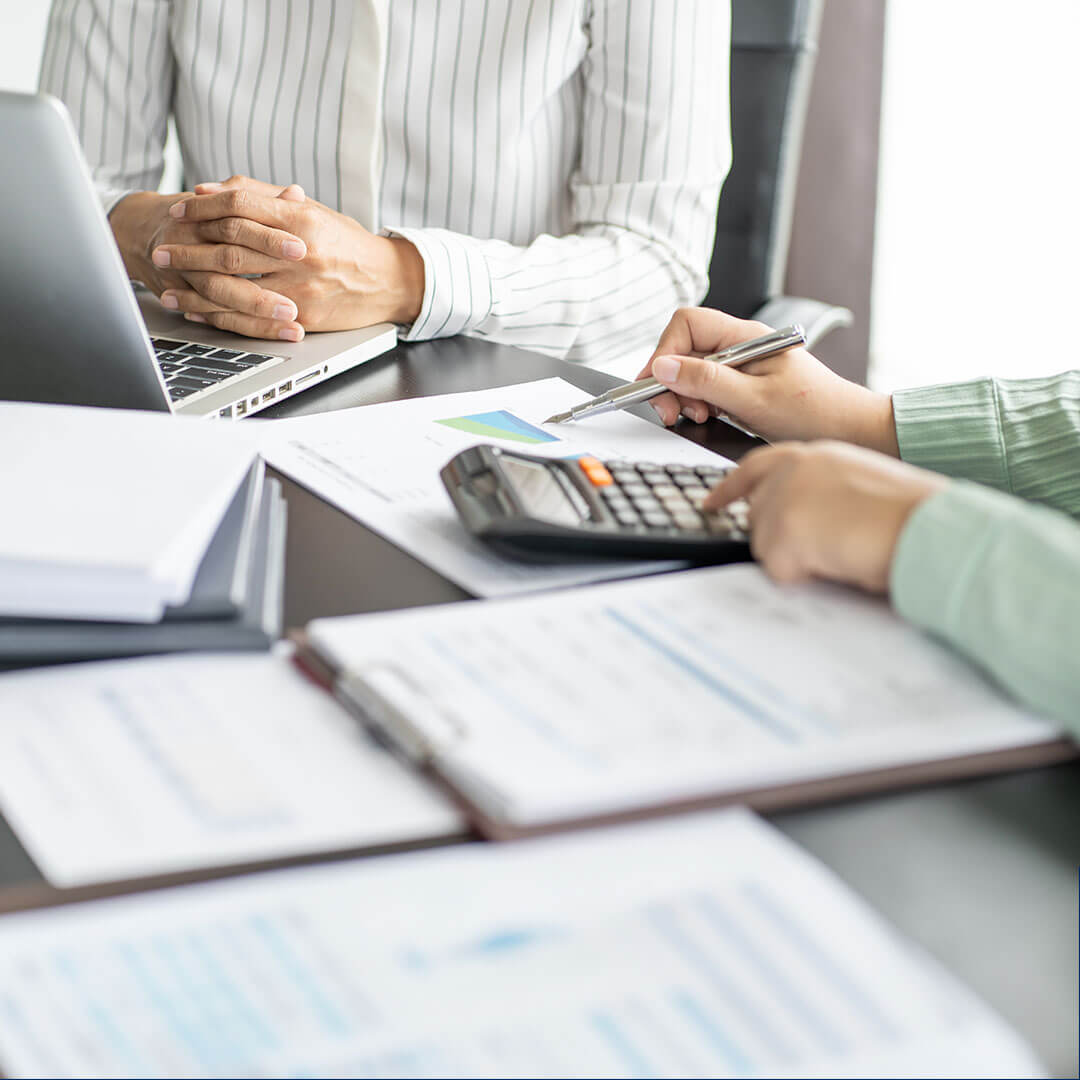 Bookkeeppers working on the financial documents for a client.
